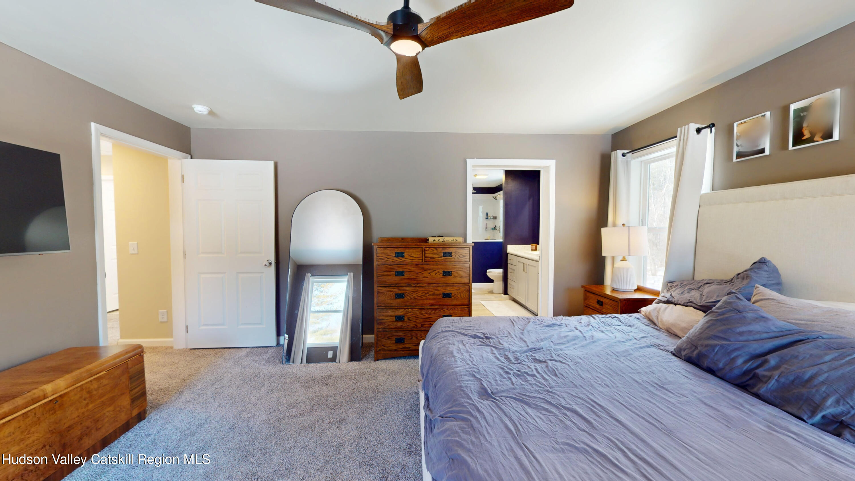 1608 Sleepy Hollow Road Athens, NY 12015 - Photo 24 of 46 a bedroom with a bed dresser and a flat tv screen