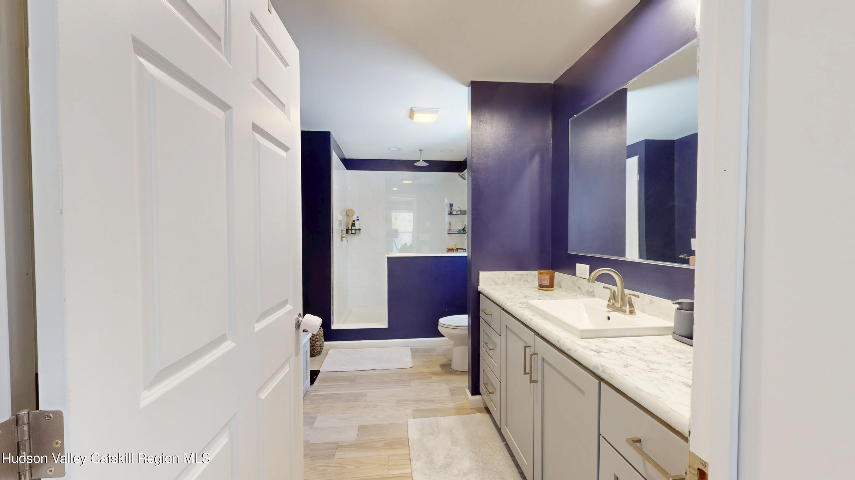 1608 Sleepy Hollow Road Athens, NY 12015 - Photo 28 of 46 a bathroom with a granite countertop sink mirror and a bathtub