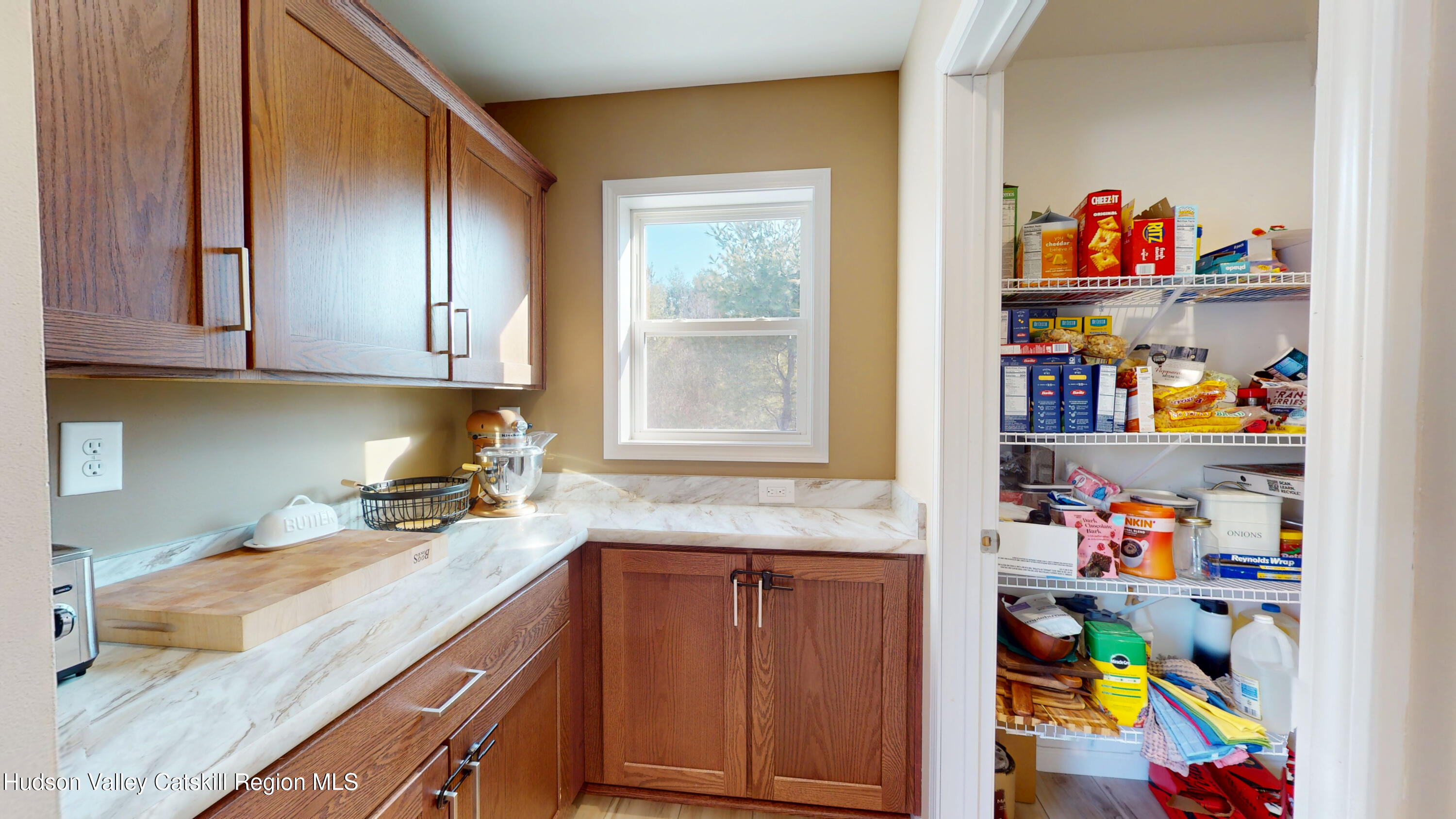 1608 Sleepy Hollow Road Athens, NY 12015 - Photo 5 of 46 a kitchen with lots of clutter and cabinets