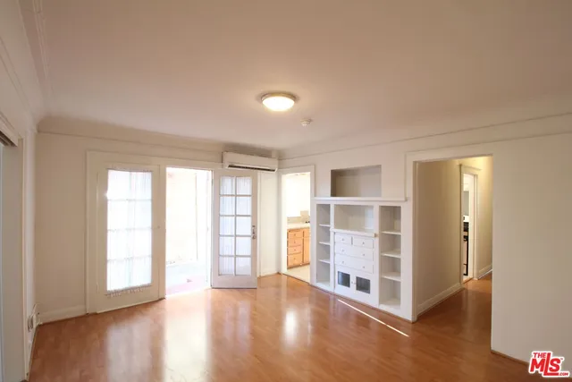 a kitchen with a refrigerator and a sink