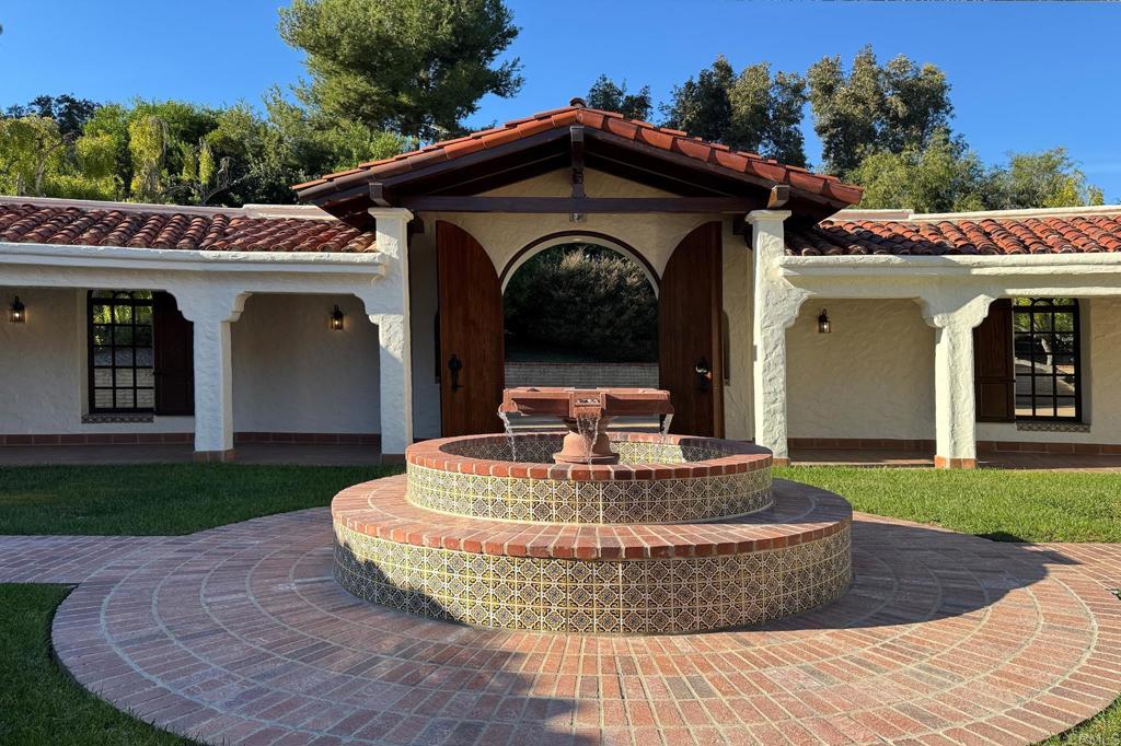 5443 Calzada Del Bosque Rancho Santa Fe, CA 92067 - Photo 11 of 63 a view of a house with brick walls and a yard