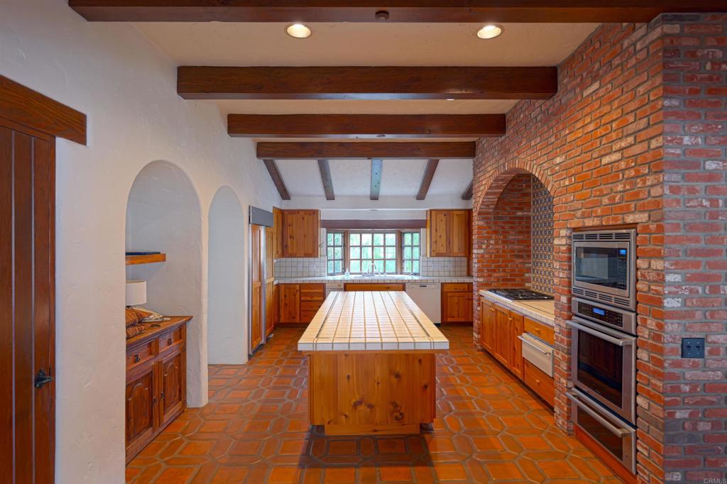 5443 Calzada Del Bosque Rancho Santa Fe, CA 92067 - Photo 15 of 56 a very nice looking room with a fireplace