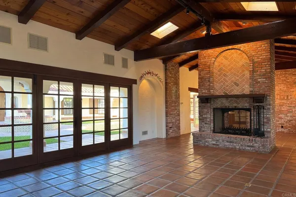 a view of livingroom with fireplace and wooden floor