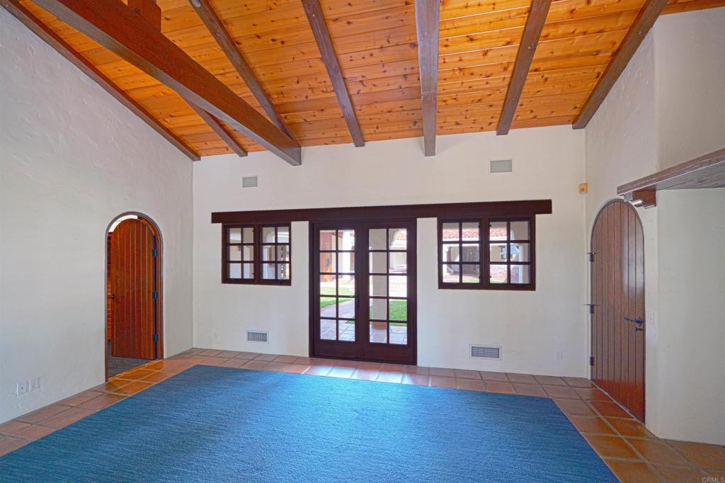 5443 Calzada Del Bosque Rancho Santa Fe, CA 92067 - Photo 31 of 56 a view of empty room with wooden floor and fan