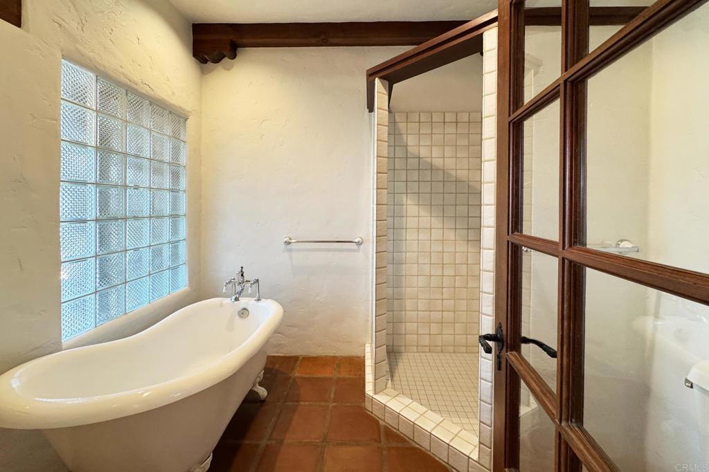 5443 Calzada Del Bosque Rancho Santa Fe, CA 92067 - Photo 40 of 62 a bathroom with a bathtub and shower