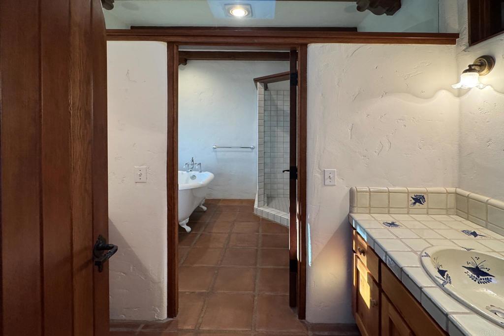 5443 Calzada Del Bosque Rancho Santa Fe, CA 92067 - Photo 41 of 62 a bathroom with a sink and a mirror