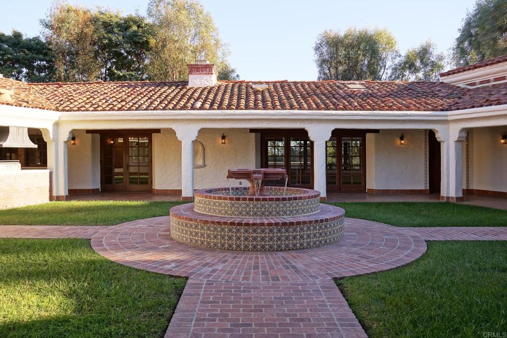 5443 Calzada Del Bosque Rancho Santa Fe, CA 92067 - Photo 42 of 63 a front view of a house with a yard