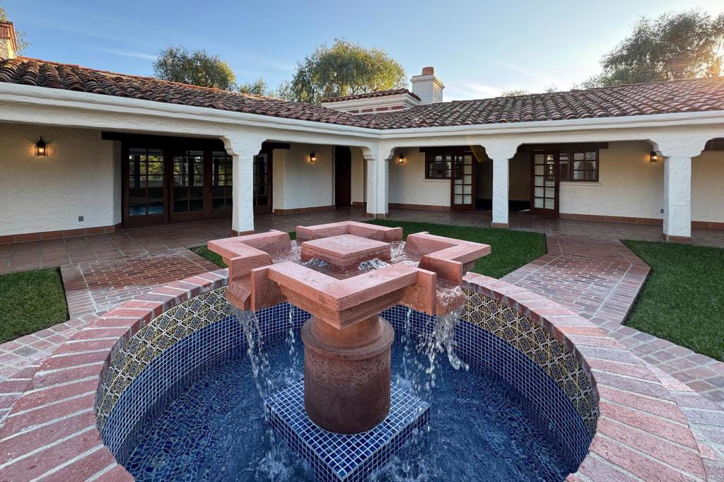 5443 Calzada Del Bosque Rancho Santa Fe, CA 92067 - Photo 51 of 62 a view of a house with backyard sitting area and porch
