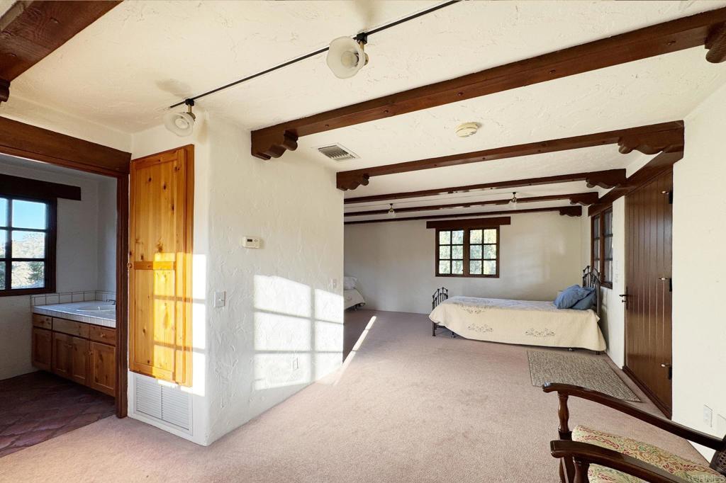 5443 Calzada Del Bosque Rancho Santa Fe, CA 92067 - Photo 52 of 63 a bedroom with a bed and a window