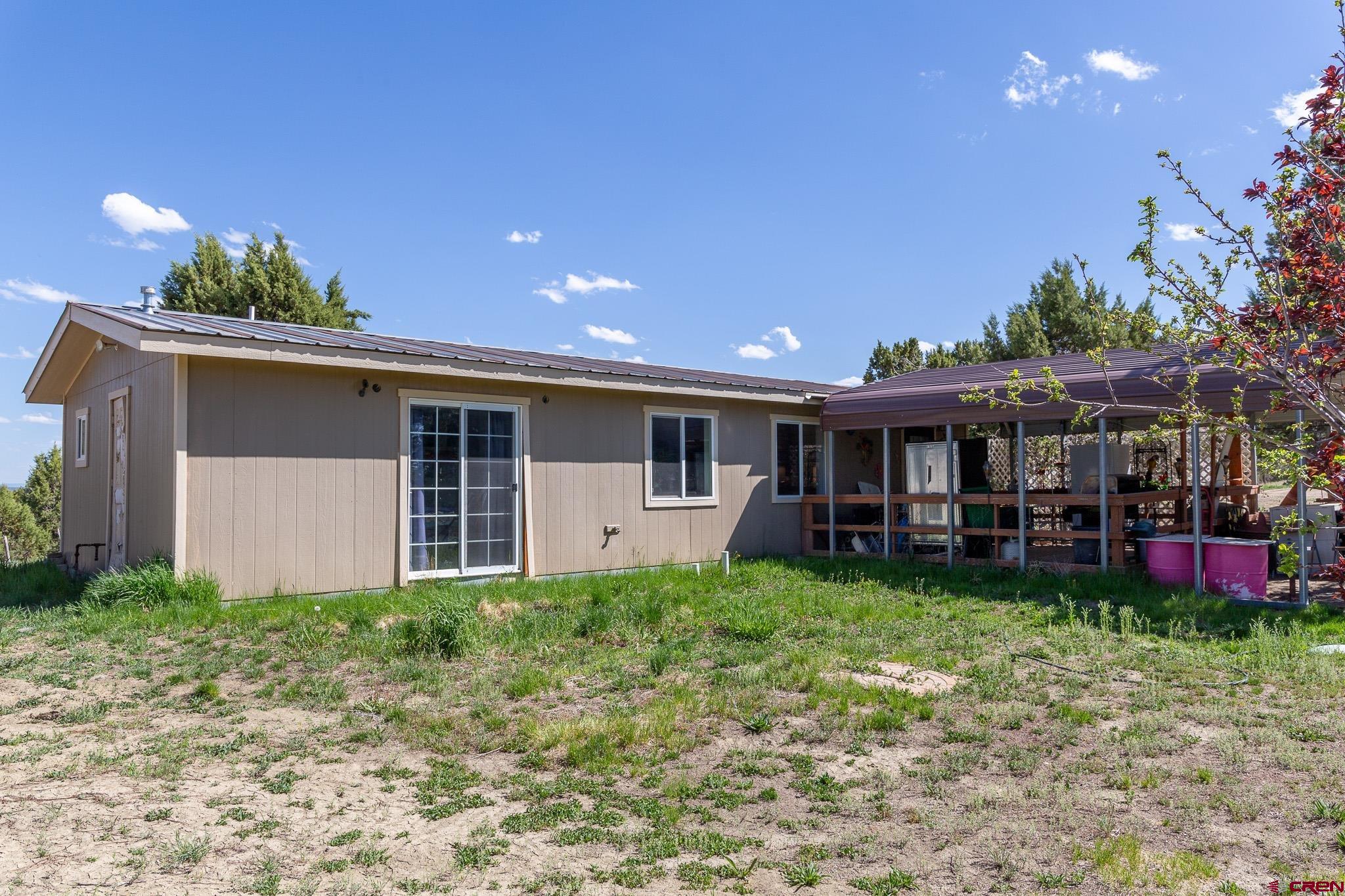 329 Payne Lane Ignacio, CO 81137 - Photo 13 of 45 a view of a house with a yard and sitting area