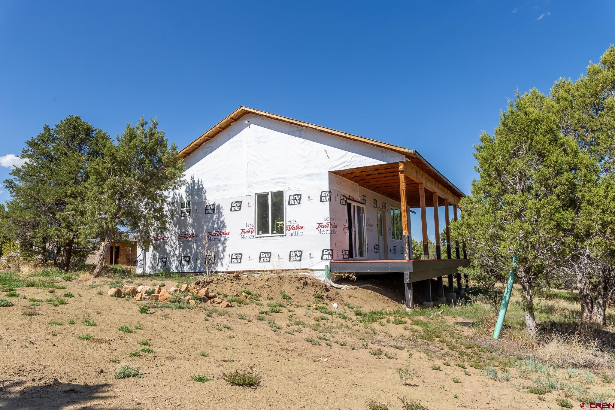 329 Payne Lane Ignacio, CO 81137 - Photo 22 of 45 a front view of a house with a yard