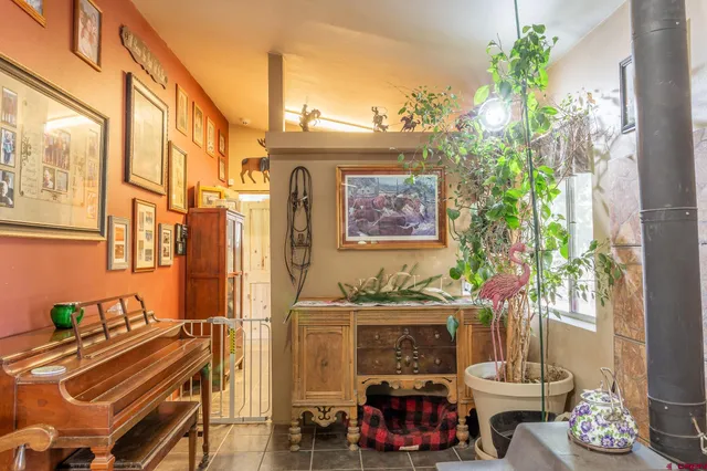 a view of a room with furniture and a potted plant