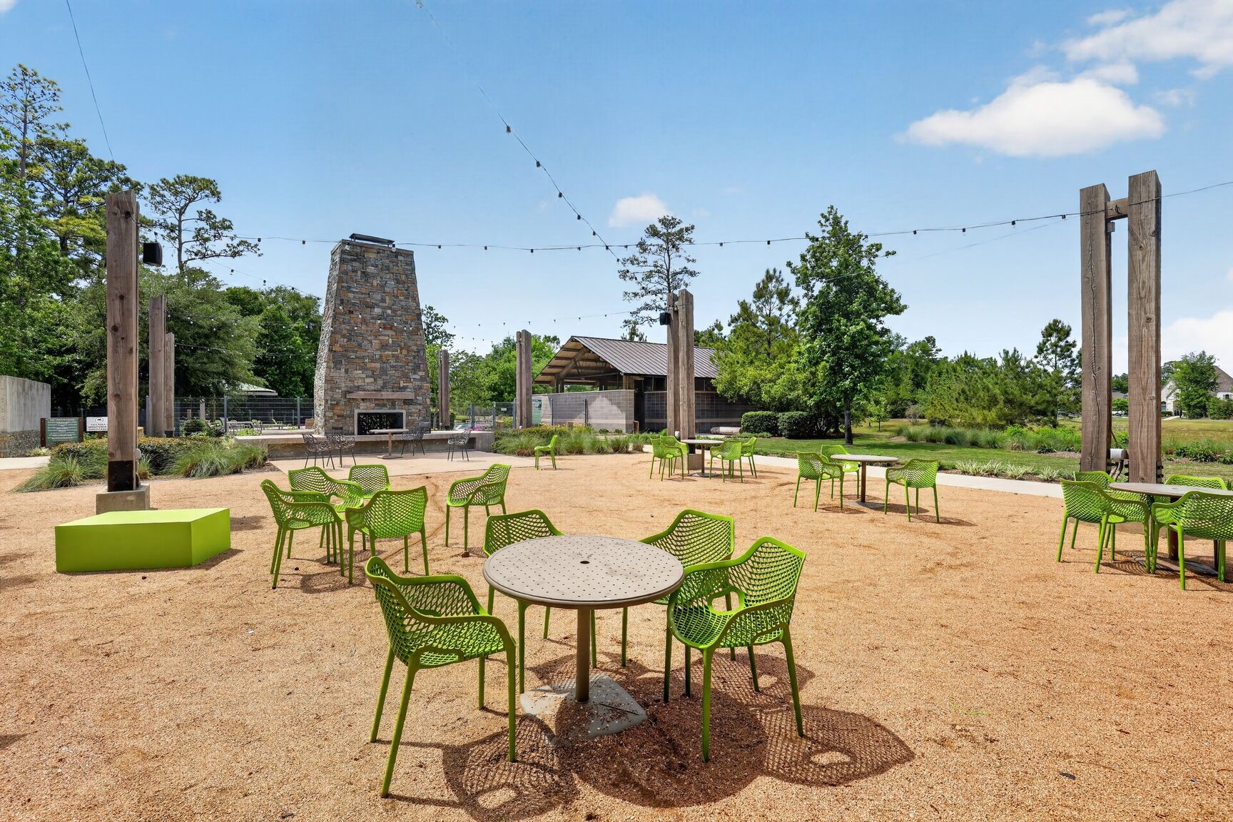 11231 Burgus Farm Road Humble, TX 77346 - Photo 25 of 28 Cozy outdoor fireplace, and plenty of picnic seating, it’s the ultimate spot for sunset s’mores, weekend birthday parties, or just catching up with neighbors.
