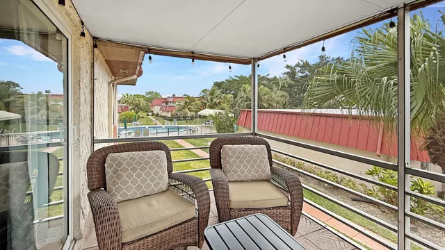 a view of a two chair in the balcony