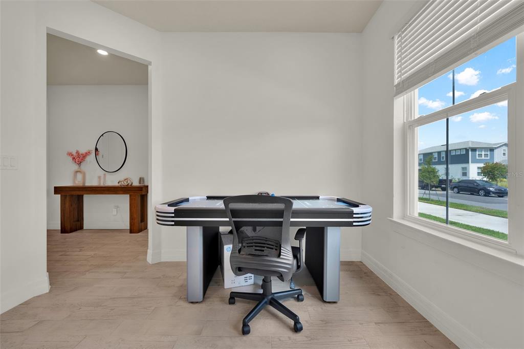 11362 Rising Sun Street Orlando, FL 32829 - Photo 13 of 35 a view of a workspace with furniture