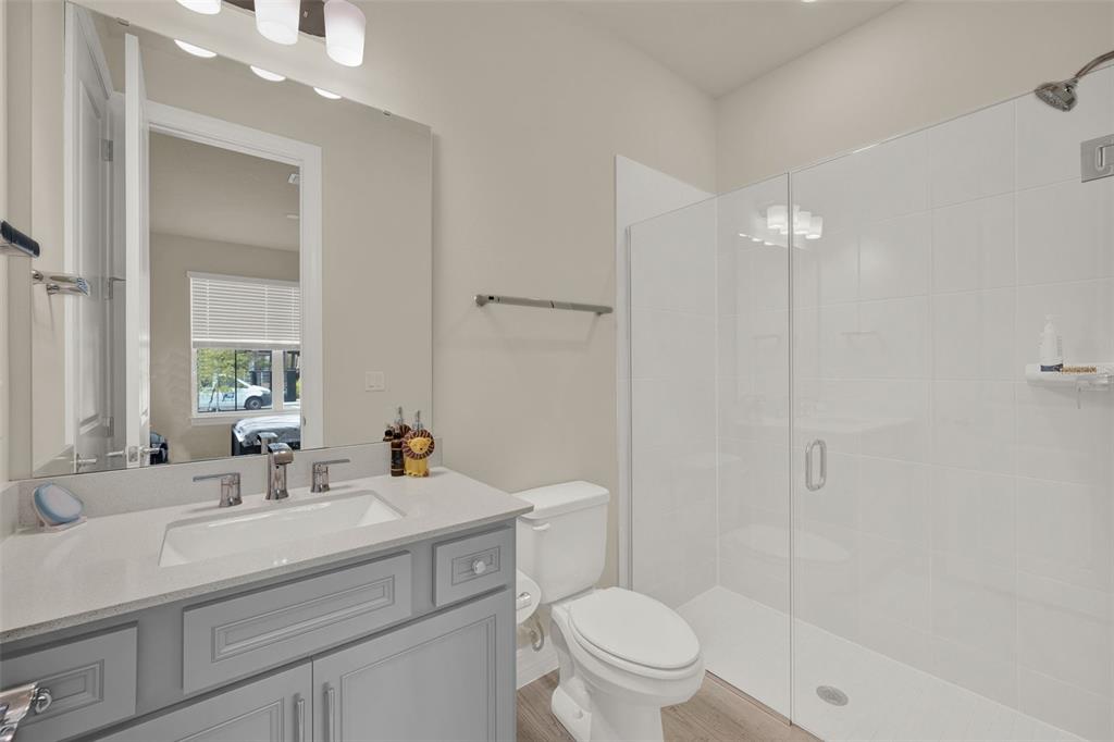 11362 Rising Sun Street Orlando, FL 32829 - Photo 17 of 35 a bathroom with a sink a toilet and shower