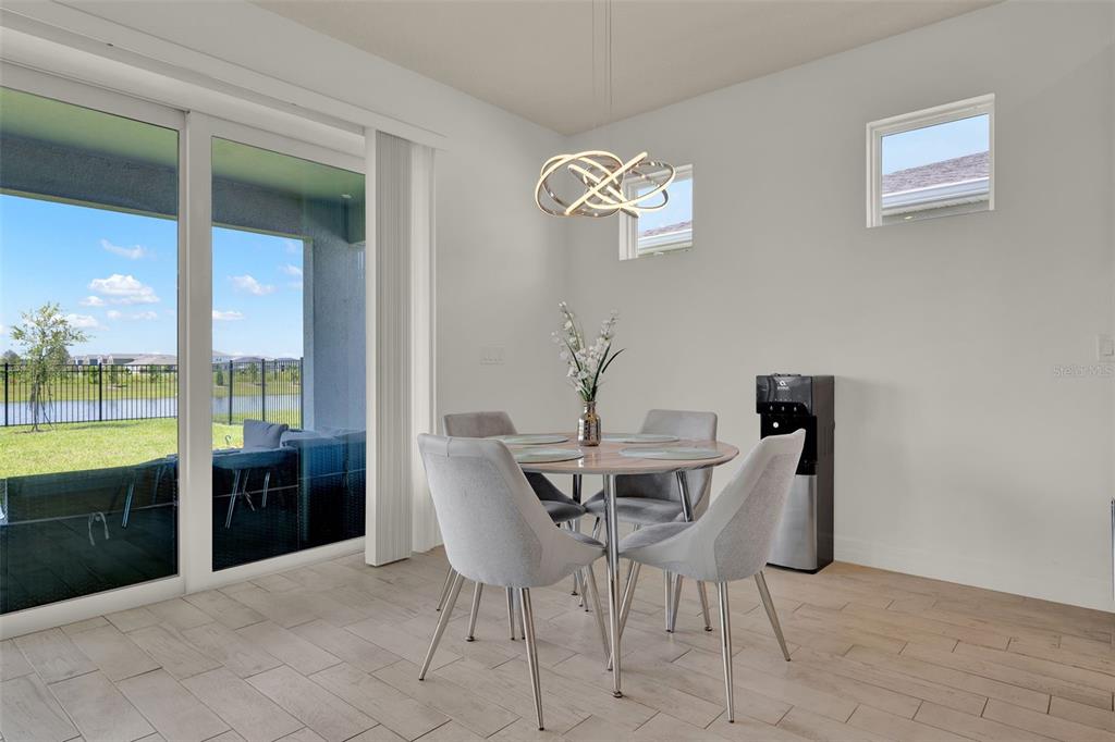 11362 Rising Sun Street Orlando, FL 32829 - Photo 22 of 35 a view of a dining room with furniture and chandelier