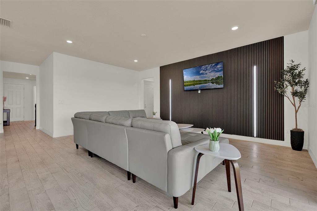 11362 Rising Sun Street Orlando, FL 32829 - Photo 24 of 35 a living room with furniture and wooden floor