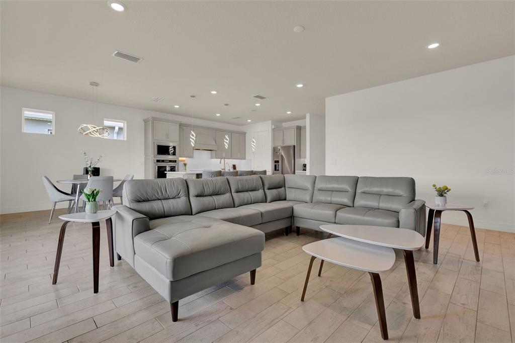 11362 Rising Sun Street Orlando, FL 32829 - Photo 25 of 35 a living room with furniture and a wooden floor