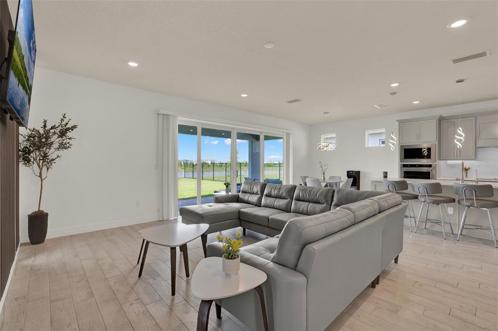 11362 Rising Sun Street Orlando, FL 32829 - Photo 26 of 35 a living room with furniture and a large window
