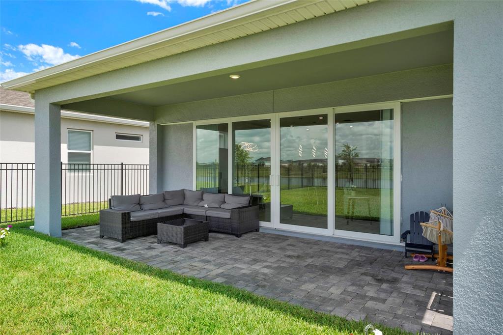 11362 Rising Sun Street Orlando, FL 32829 - Photo 32 of 35 a living room with furniture and large windows