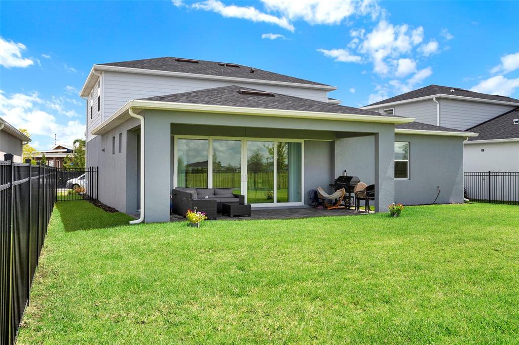 11362 Rising Sun Street Orlando, FL 32829 - Photo 34 of 35 a view of a house with backyard
