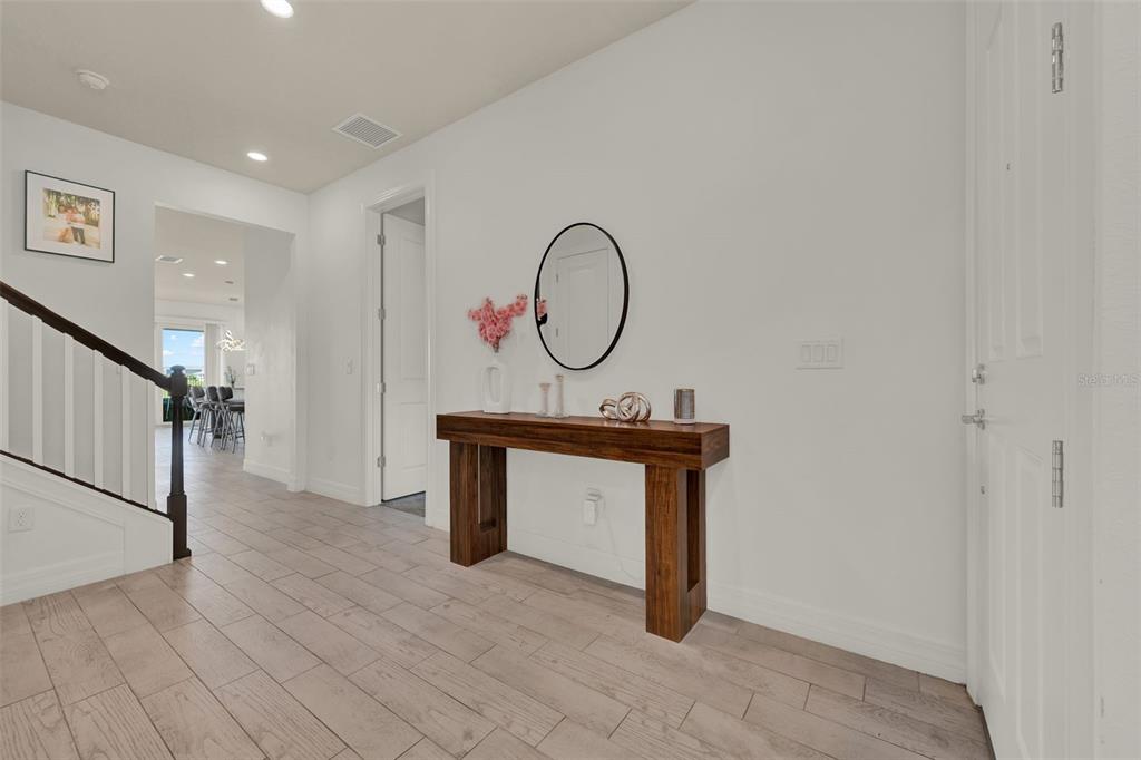 11362 Rising Sun Street Orlando, FL 32829 - Photo 5 of 35 a view of a entryway with wooden floor