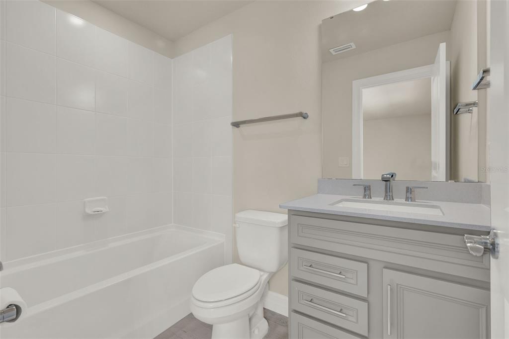 11362 Rising Sun Street Orlando, FL 32829 - Photo 7 of 35 a bathroom with a sink a toilet and a bathtub