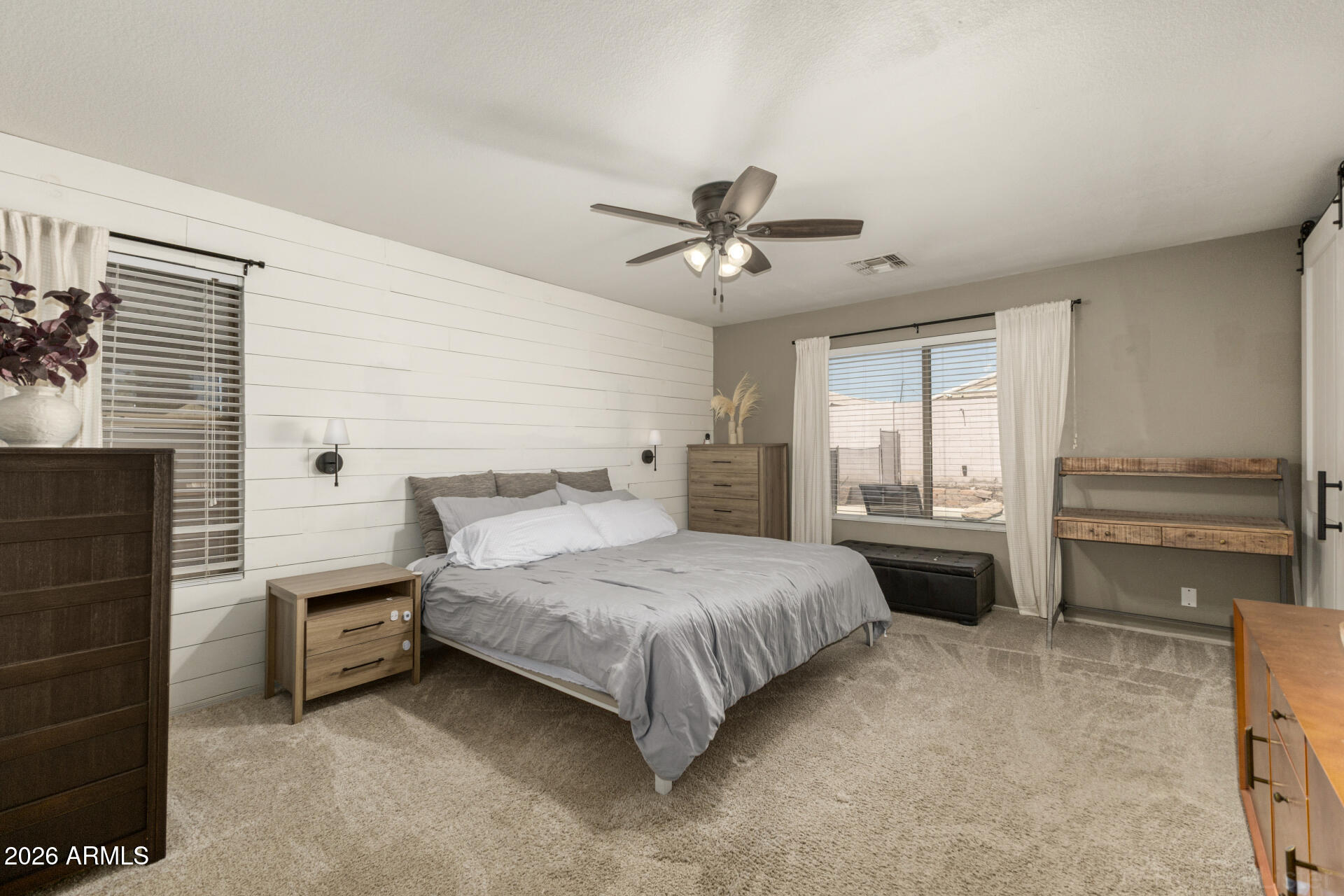 1736 East Robin Lane Gilbert, AZ 85296 - Photo 11 of 25 a bedroom with a bed and a chandelier