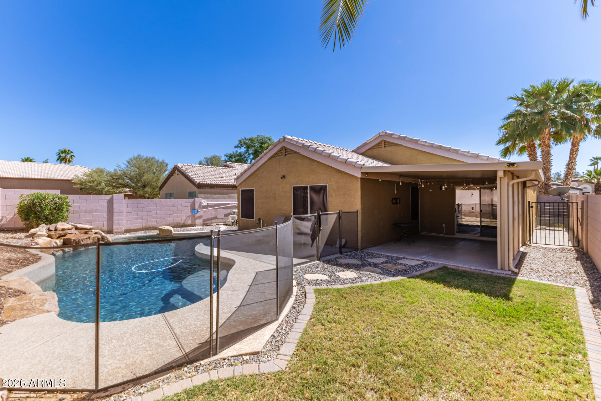 1736 East Robin Lane Gilbert, AZ 85296 - Photo 22 of 25 a view of house with swimming pool outdoor seating