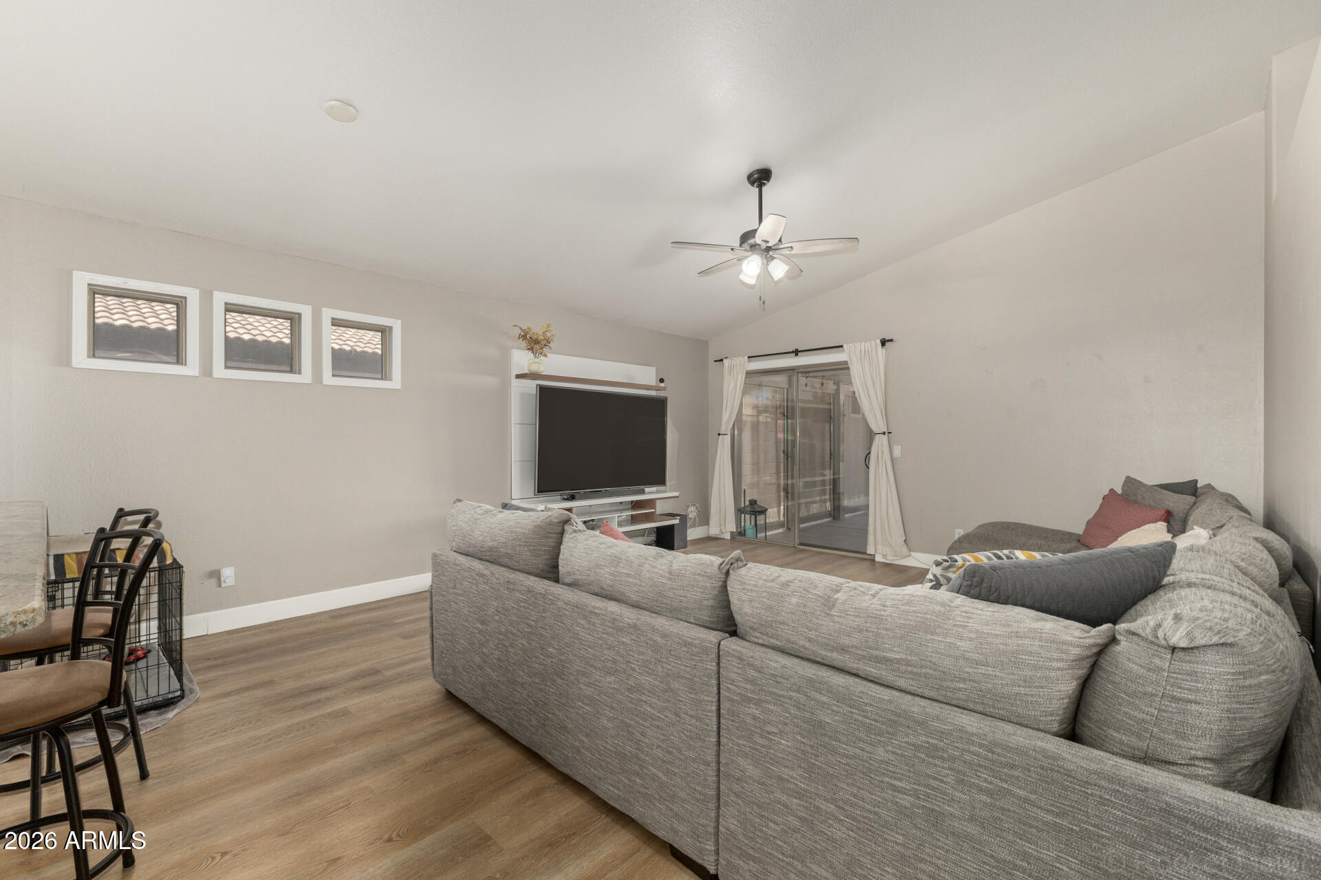 1736 East Robin Lane Gilbert, AZ 85296 - Photo 3 of 25 a living room with furniture and a flat screen tv
