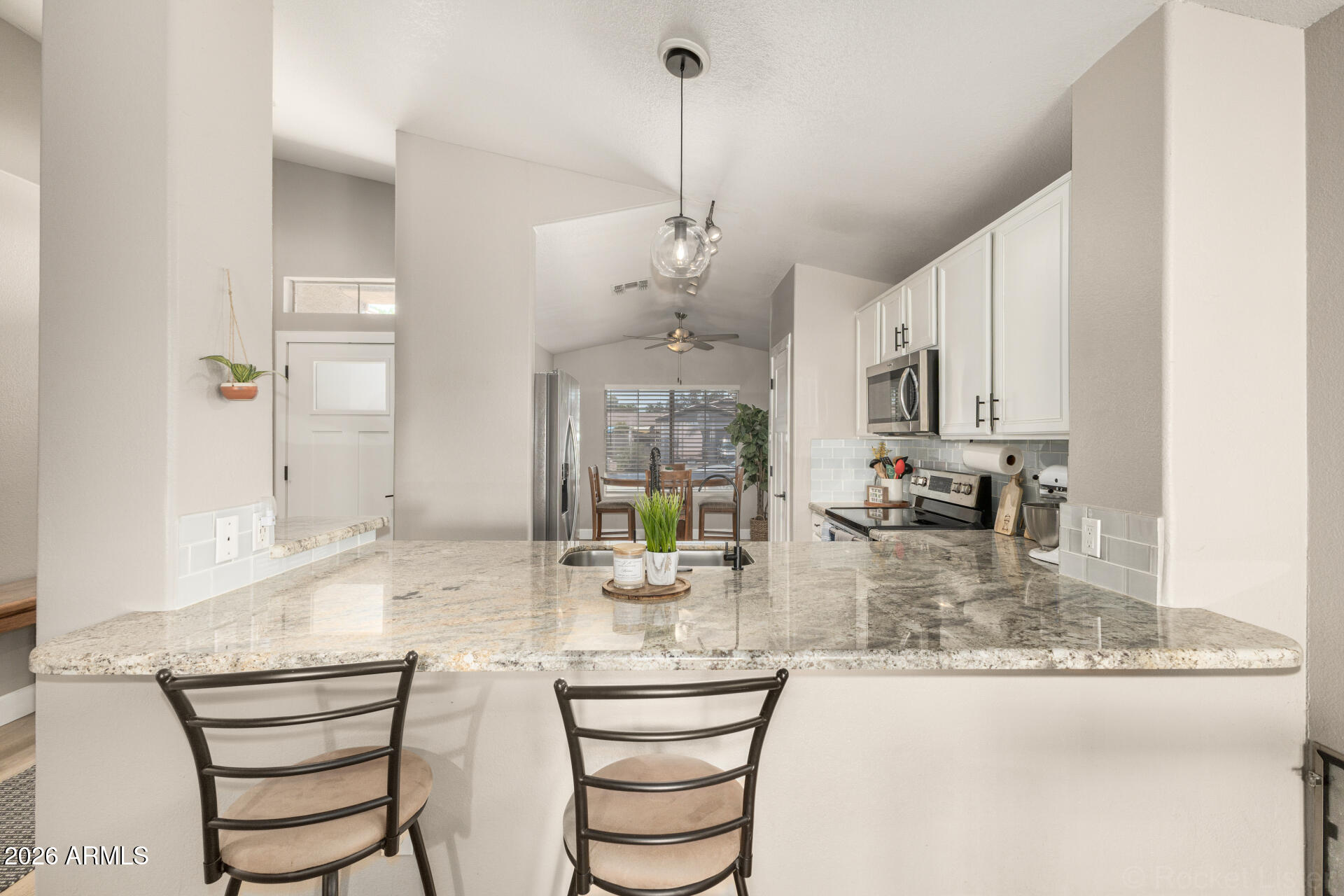 1736 East Robin Lane Gilbert, AZ 85296 - Photo 7 of 25 a dining room with furniture and window