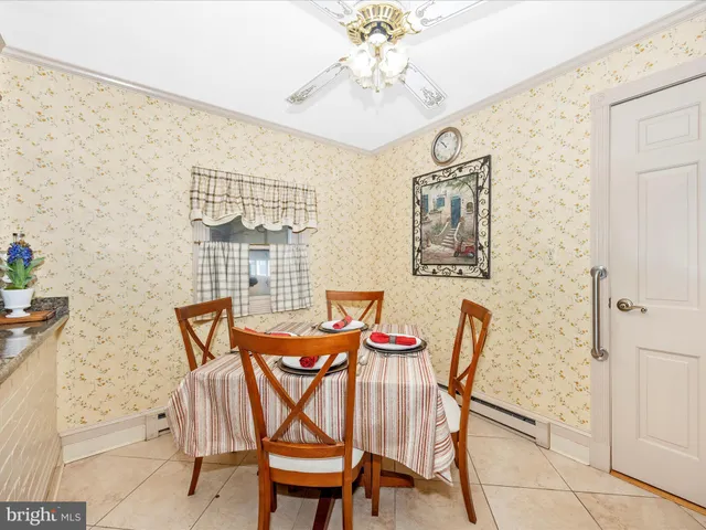 a bathroom with a sink a toilet and a shower curtain
