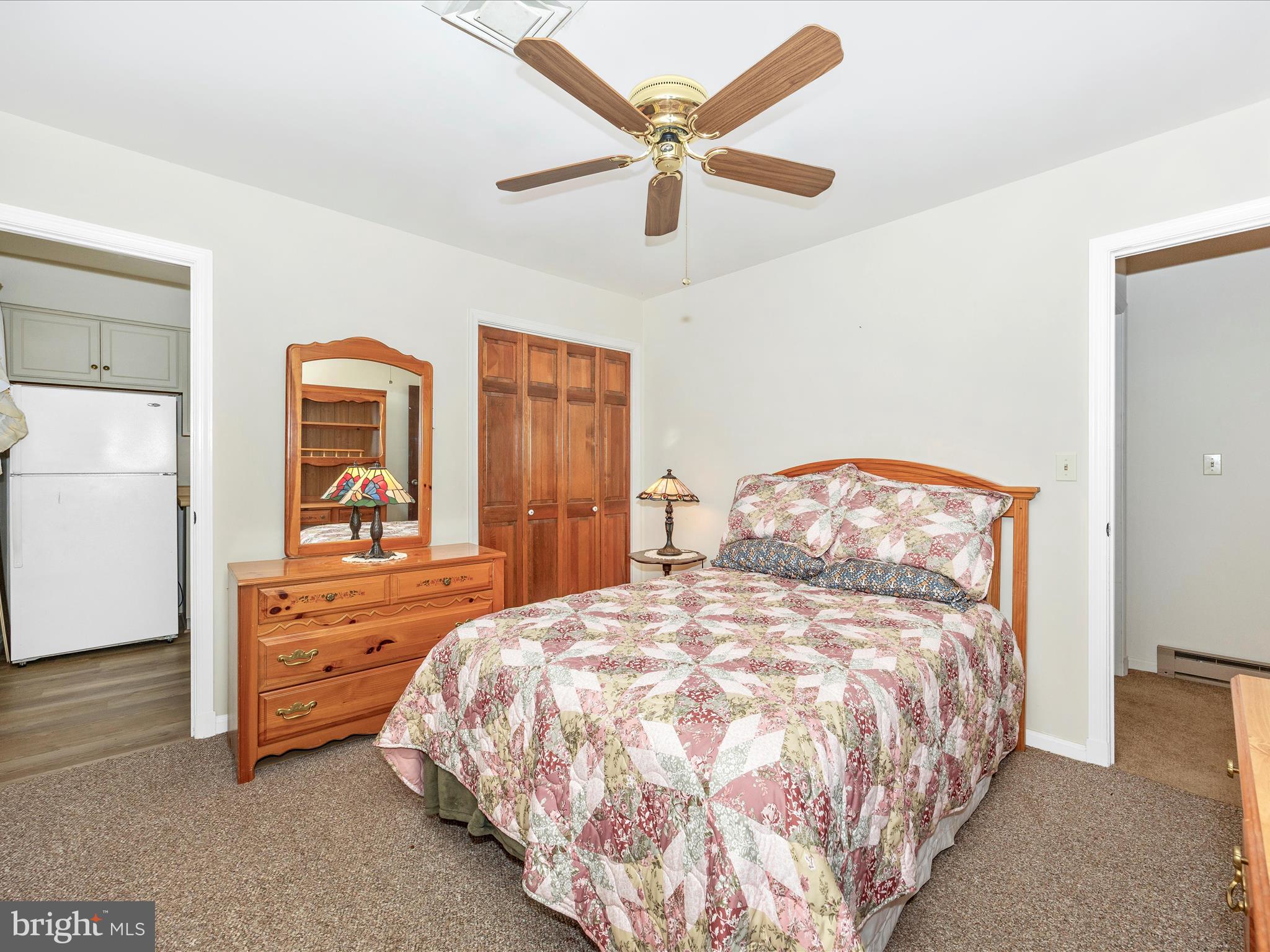 17515 Dr Bird Road Sandy Spring, MD 20860 - Photo 35 of 76 a bedroom with a bed and a dresser