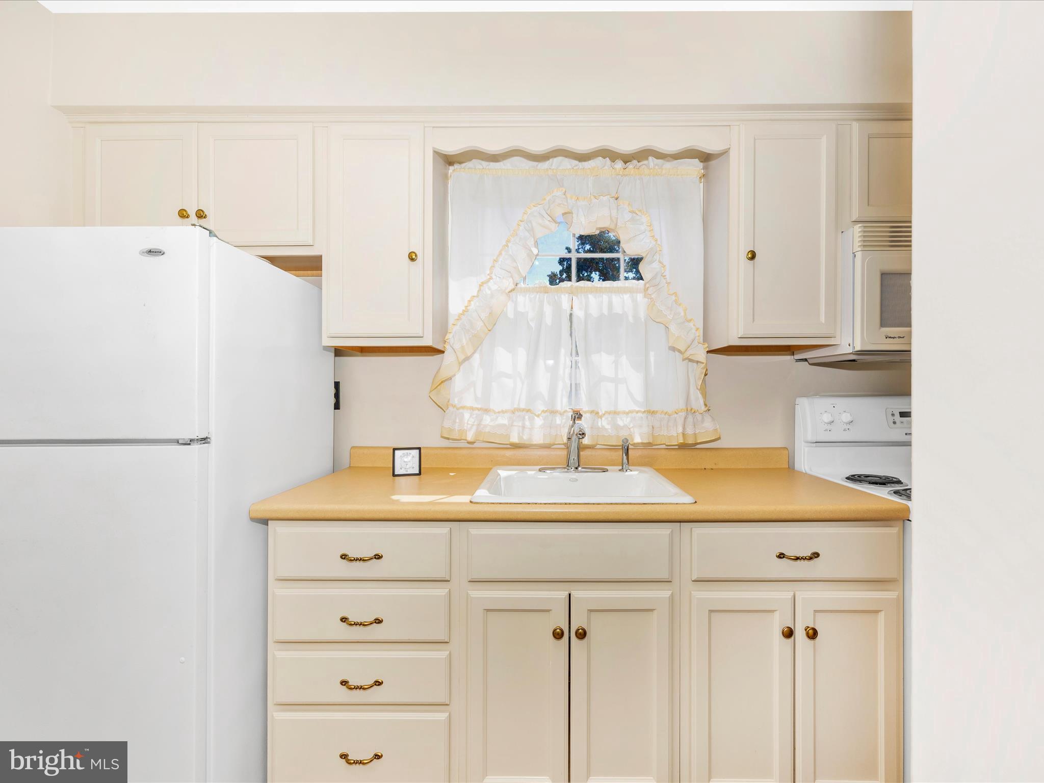 17515 Dr Bird Road Sandy Spring, MD 20860 - Photo 39 of 76 a bathroom with a sink and a mirror