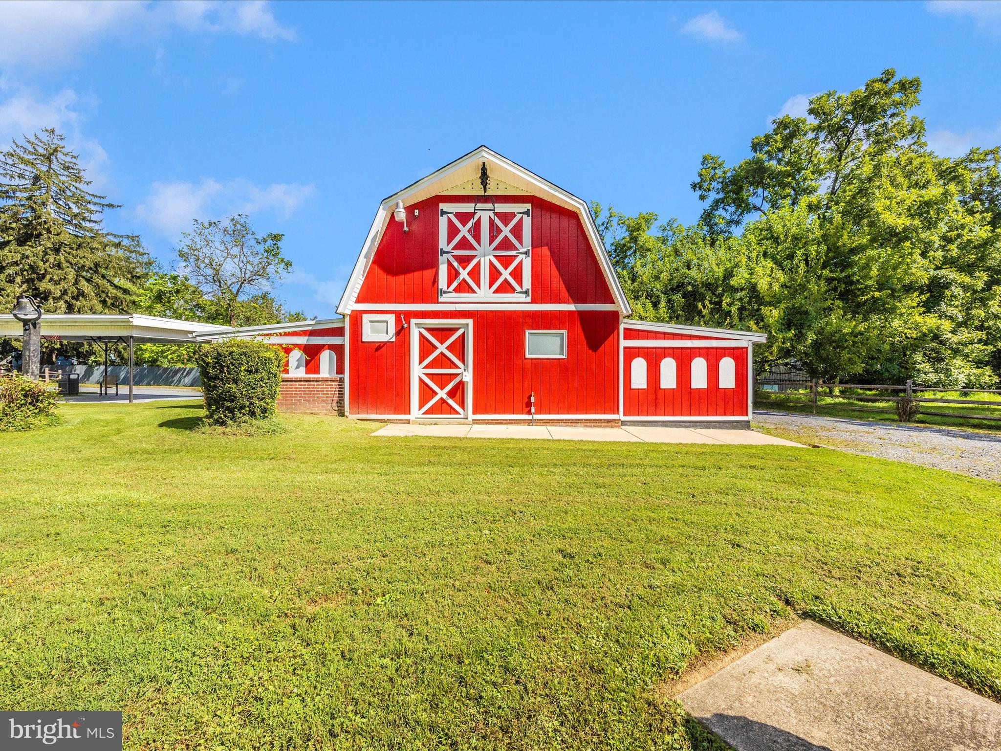 17515 Dr Bird Road Sandy Spring, MD 20860 - Photo 66 of 76 a sign that is sitting in the middle of a field with trees in the background