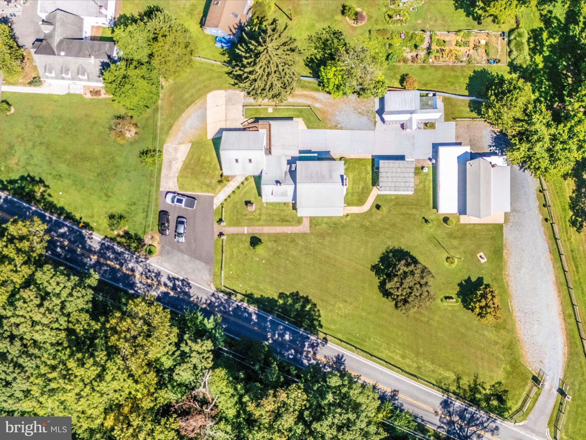 17515 Dr Bird Road Sandy Spring, MD 20860 - Photo 69 of 76 an aerial view of a house with a swimming pool