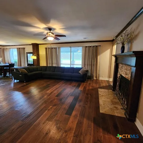 a view of fireplace and a wooden floor