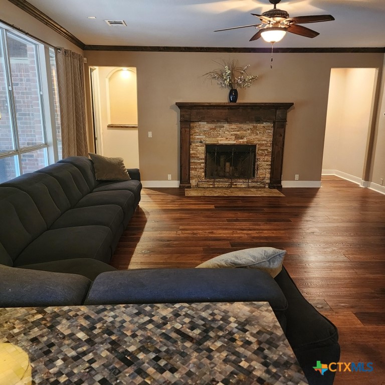11710 Uplands Ridge Drive Austin, TX 78738 - Photo 18 of 33 a living room with a couch and a fireplace