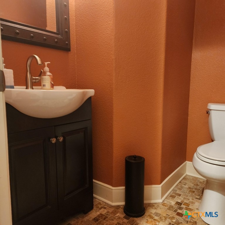 11710 Uplands Ridge Drive Austin, TX 78738 - Photo 20 of 33 a bathroom with a sink and a toilet