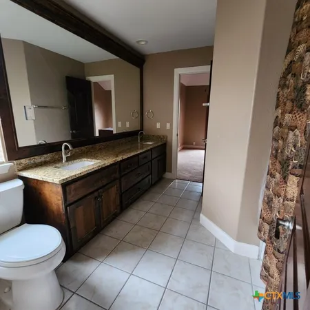 a bedroom with a bed and furniture