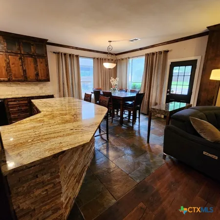 a view of a dining room with furniture window and outside view