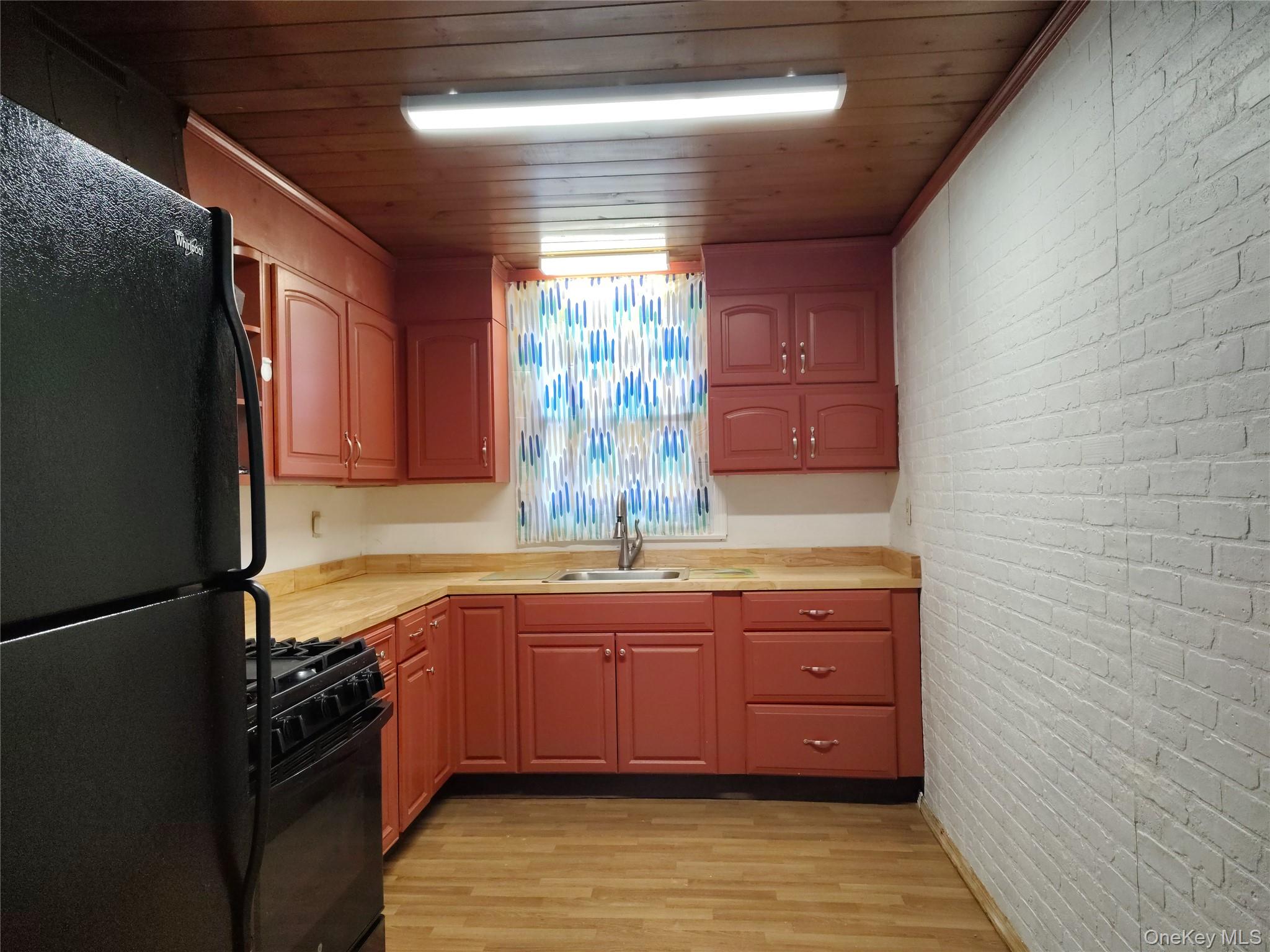 32 Vernon Terrace, Unit 1 Poughkeepsie, NY 12601 - Photo 4 of 11 a kitchen with stainless steel appliances granite countertop a sink a stove and a refrigerator