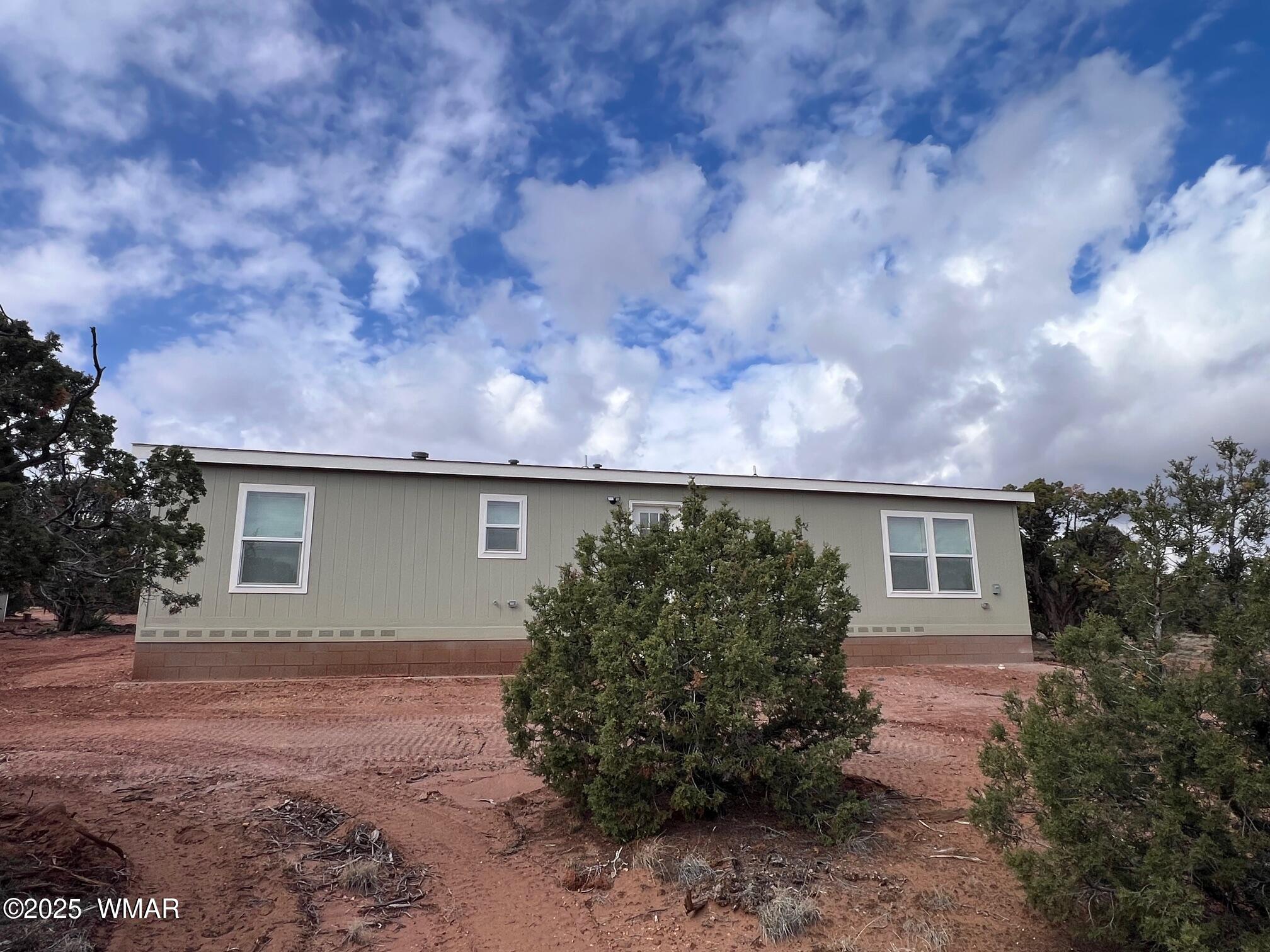 4129 Apache Road Snowflake, AZ 85937 - Photo 5 of 48 a backyard of a house with lots of green space