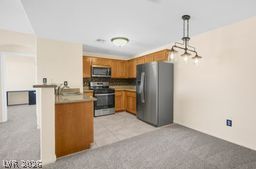 7701 West Robindale Road, Unit 277 Las Vegas, NV 89113 - Photo 8 of 33 A well-lit culinary space features robust cabinetry and practical amenities.