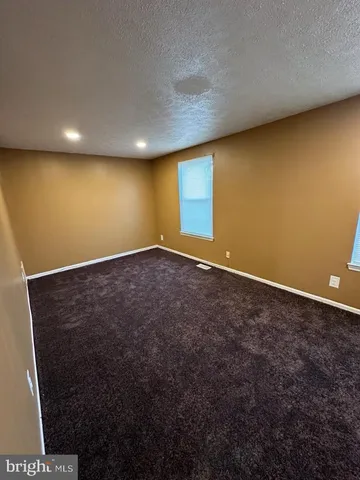 an empty room with a wooden door