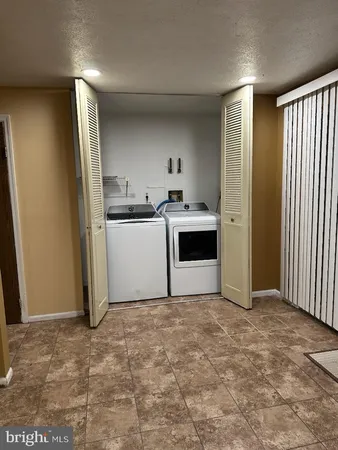 a kitchen with stainless steel appliances a refrigerator and a stove top oven