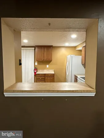 a view of a hallway to a room