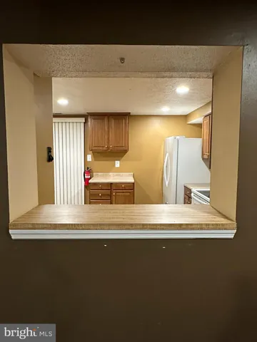 a view of a hallway to a room