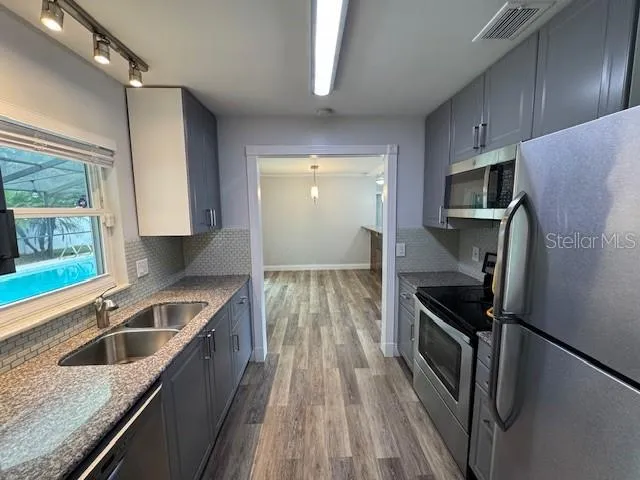 a view of empty room with windows